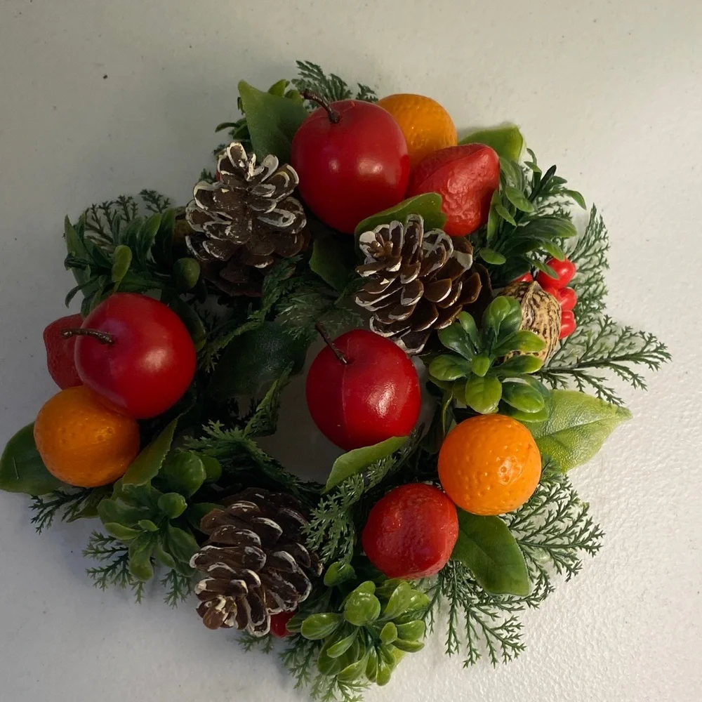 Festive Holiday Candle Wreath with Red and Orange Accents